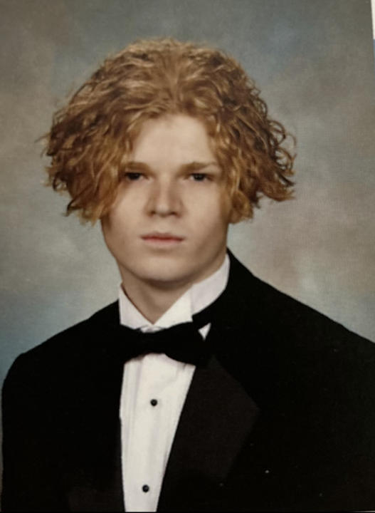 Man wearing a suit and bow tie