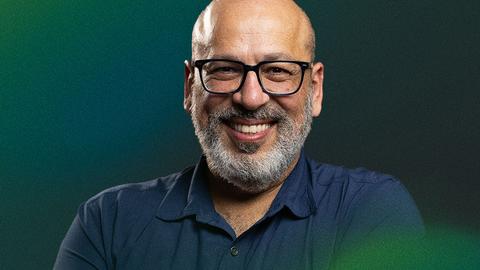 Man with beard and glasses in black shirt