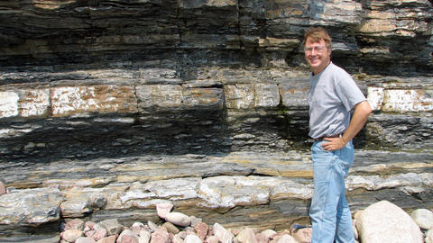 Professor Andrew Knoll standing in a quarry in Newfoundland