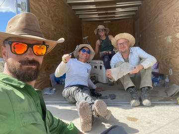 Taking a break during field work. Image courtesy of Javier Ortega-Hernandez
