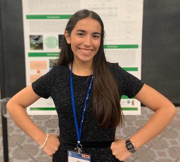 Woman standing in front of a poster
