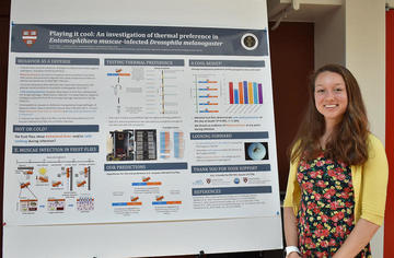 Woman standing in front of a poster