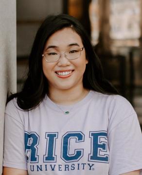 Woman with dark hair wearing glasses and t-shirt