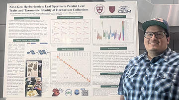 Man standing in front of a science poster