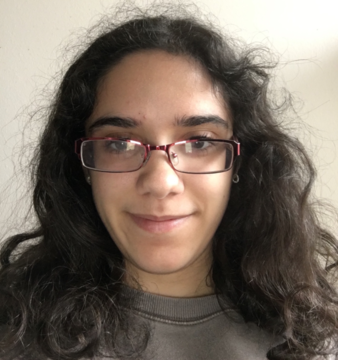 Woman with long dark hair wearing glasses