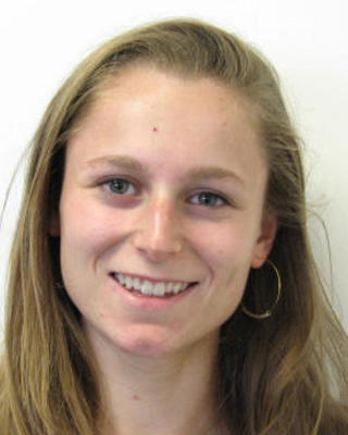 Lauren Jaeger with long blonde hair, light brown top, white background