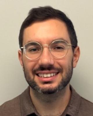Joao Ascensao with dark hair, glasses and beard