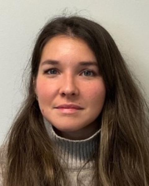 Portrait of postdoc Emilie Isasa wearing a gray sweater