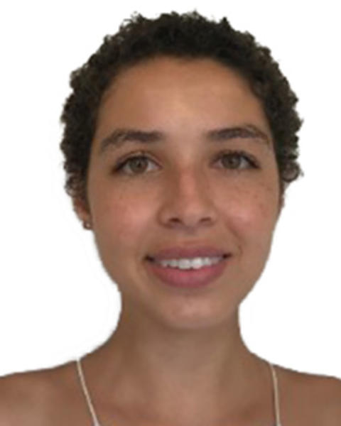 Amber Rock with short dark hair, in front of white background